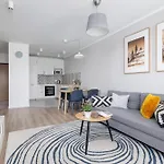 Subtle Grey Apartment With Furnished Balcony And Parking In Krakow By Noclegi Renters