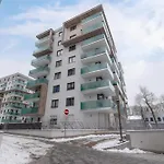 Subtle Grey Apartment With Furnished Balcony And Parking In Krakow By Noclegi Renters